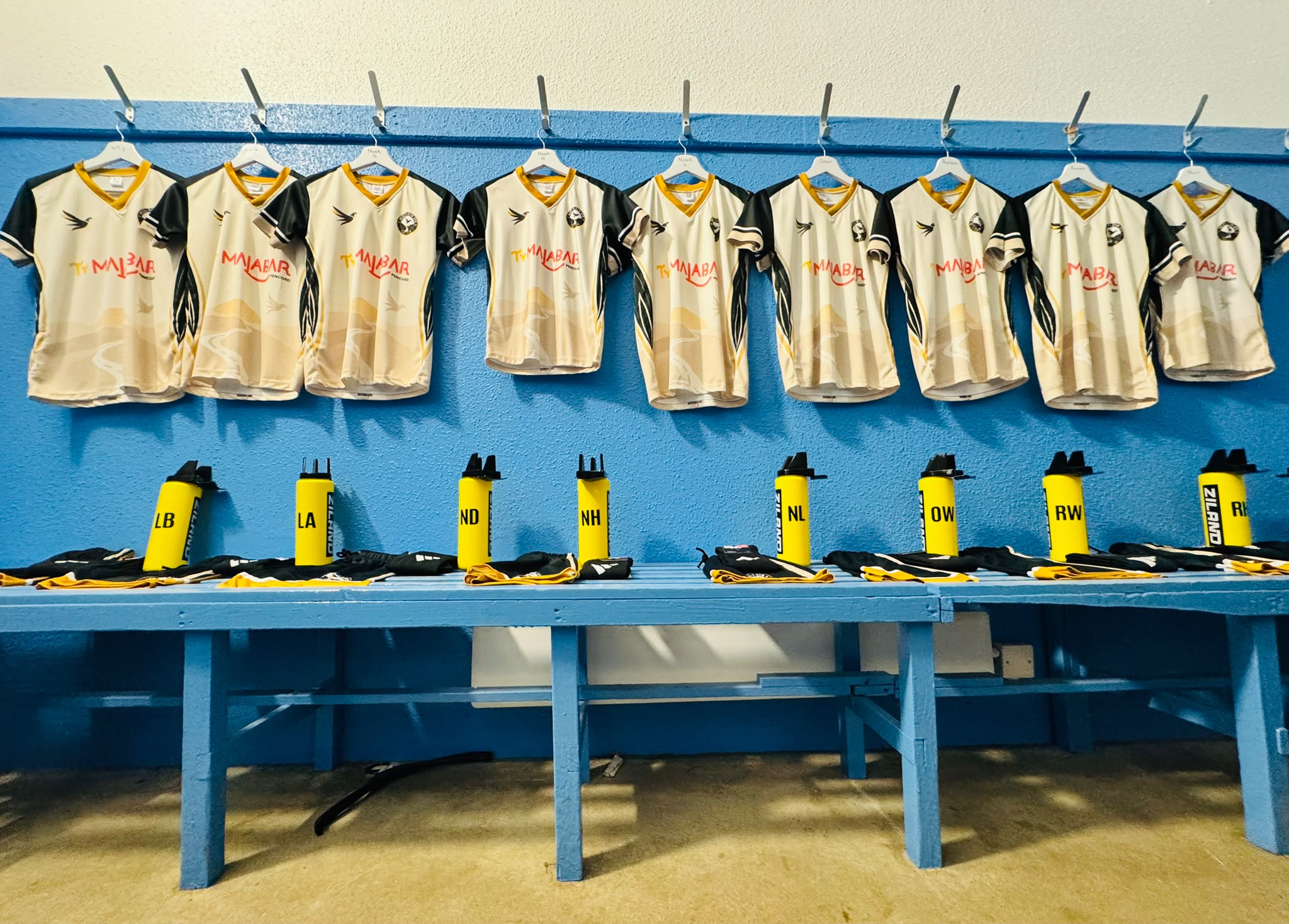 Heol-y-Cyw AFC shirts and sponsored water bottles